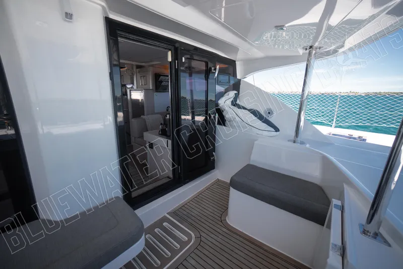 Sea Dog Yacht Photos Pics Luxurious 2020 Leopard 58 yacht interior with ocean view and modern seating area.