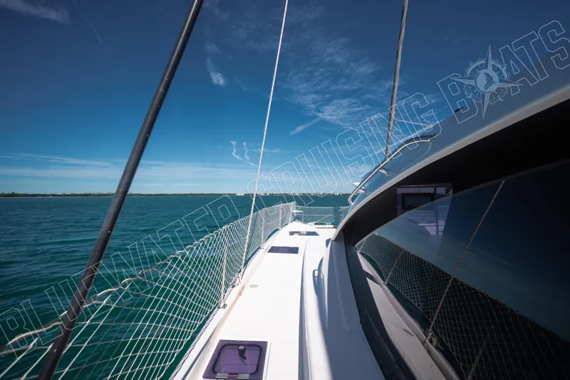Sea Dog Yacht Photos Pics 2020 Leopard 58 yacht sailing on clear blue waters under a sunny sky.