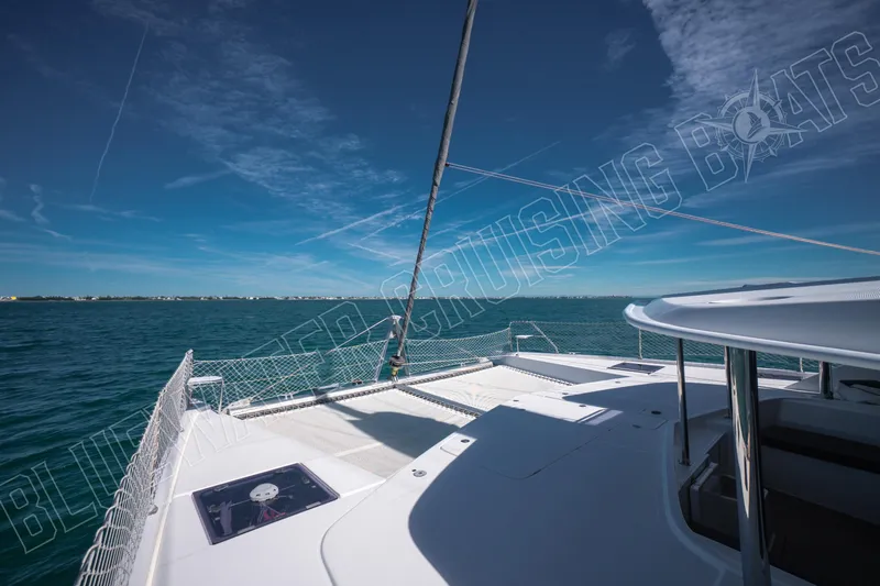 Sea Dog Yacht Photos Pics 2020 Leopard 58 yacht deck with ocean view under clear blue sky.