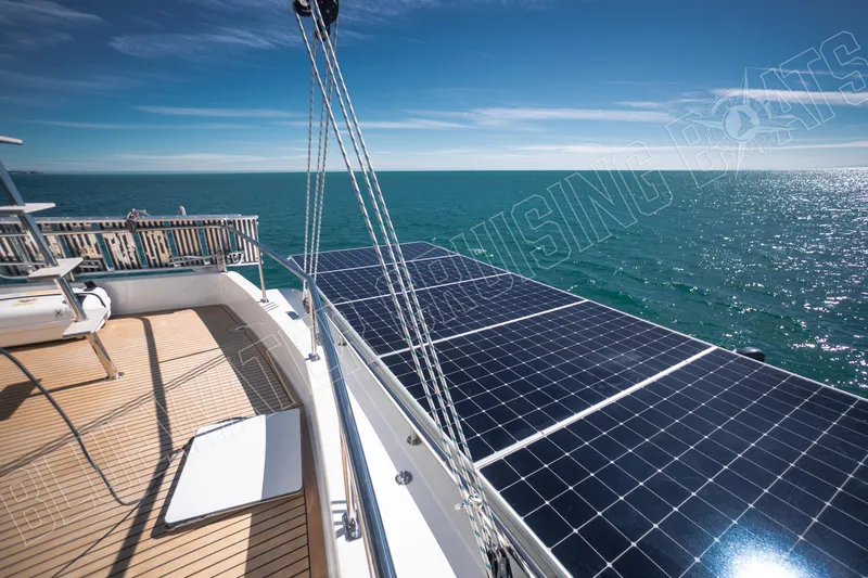 Sea Dog Yacht Photos Pics Luxury Leopard 58 yacht with solar panels, cruising on a sunny ocean in 2020.