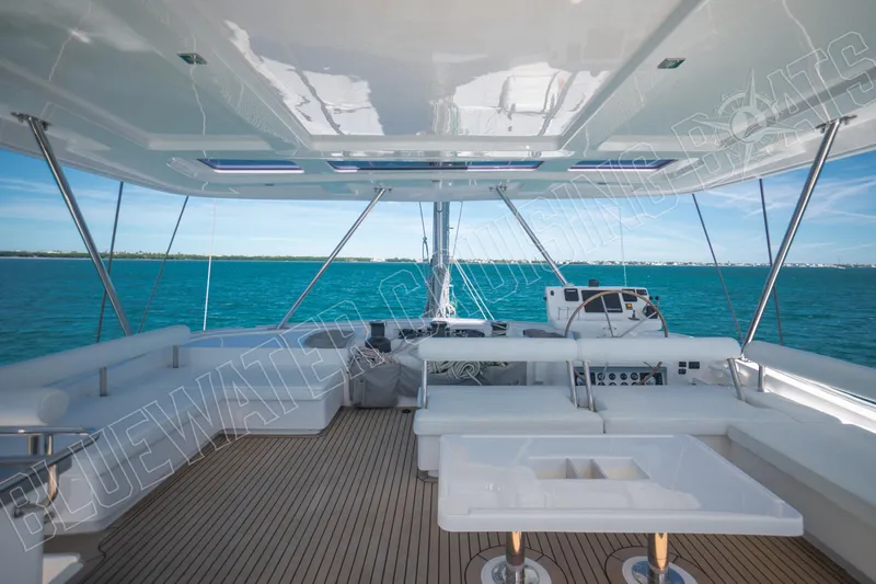 Sea Dog Yacht Photos Pics Luxurious 2020 Leopard 58 yacht interior with ocean view and modern seating.