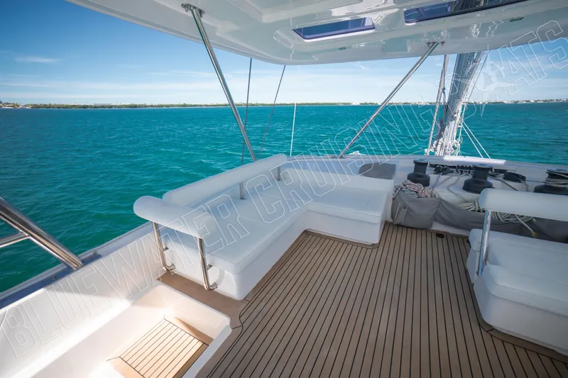 Sea Dog Yacht Photos Pics Luxurious 2020 Leopard 58 yacht deck with ocean view and comfortable seating.