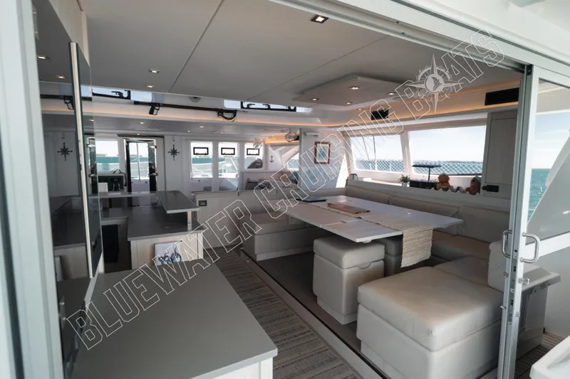 Sea Dog Yacht Photos Pics Luxurious interior of 2020 Leopard 58 yacht with modern seating and dining area.
