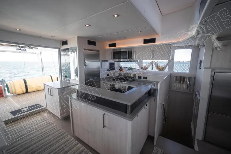 Sea Dog Yacht Photos Pics Modern kitchen interior on 2020 Leopard 58 yacht with ocean view.