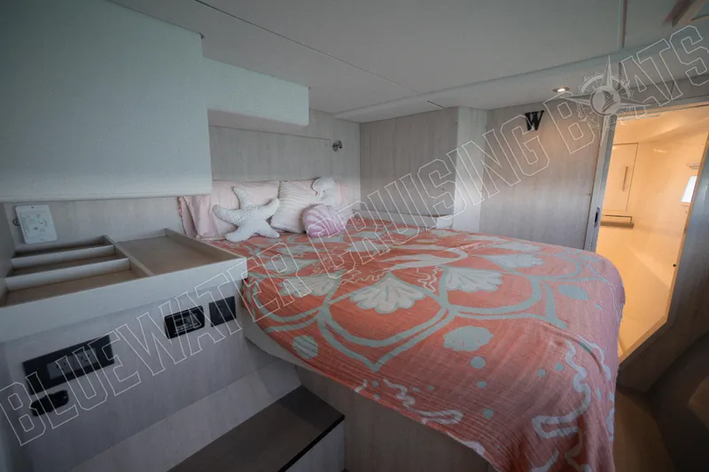 Sea Dog Yacht Photos Pics Luxurious bedroom interior of 2020 Leopard 58 yacht with stylish bedding and modern design.