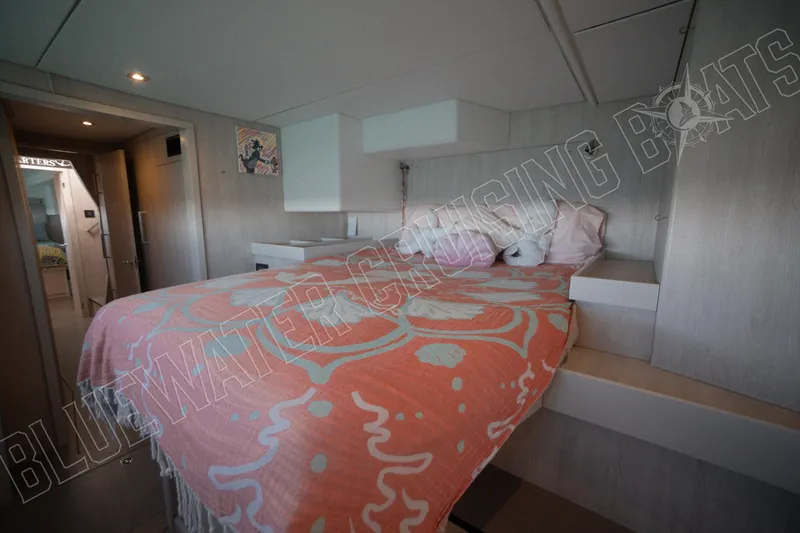 Sea Dog Yacht Photos Pics Luxurious cabin interior of 2020 Leopard 58 yacht with stylish bedding and modern design.
