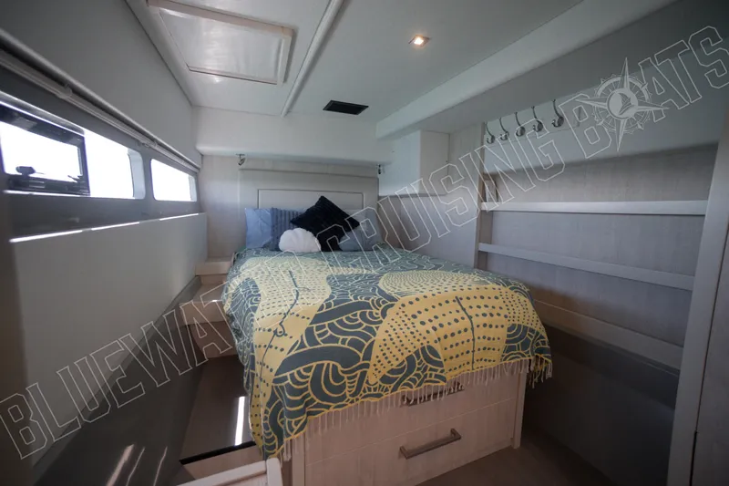 Sea Dog Yacht Photos Pics Luxurious cabin interior of 2020 Leopard 58 yacht with stylish bedding and modern design.