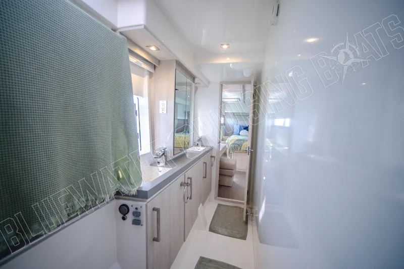 Sea Dog Yacht Photos Pics Luxurious bathroom interior of 2020 Leopard 58 yacht with modern fixtures and decor.