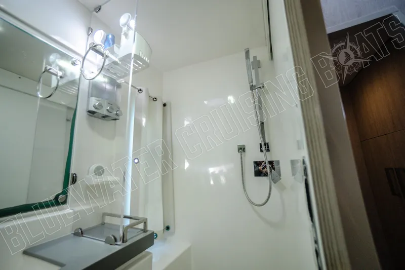 Sea Dog Yacht Photos Pics Modern bathroom interior on a 2020 Leopard 58 yacht, featuring sleek shower design.