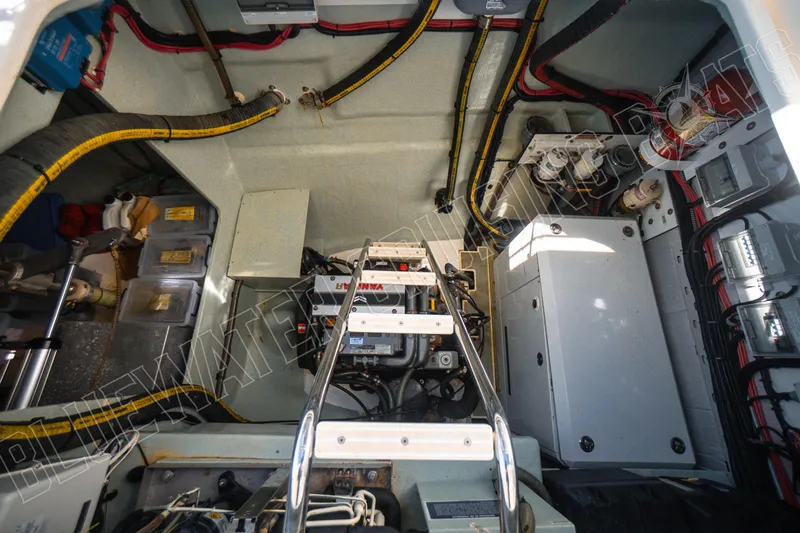 Sea Dog Yacht Photos Pics Engine room of a 2020 Leopard 58 yacht, showcasing mechanical components and wiring.