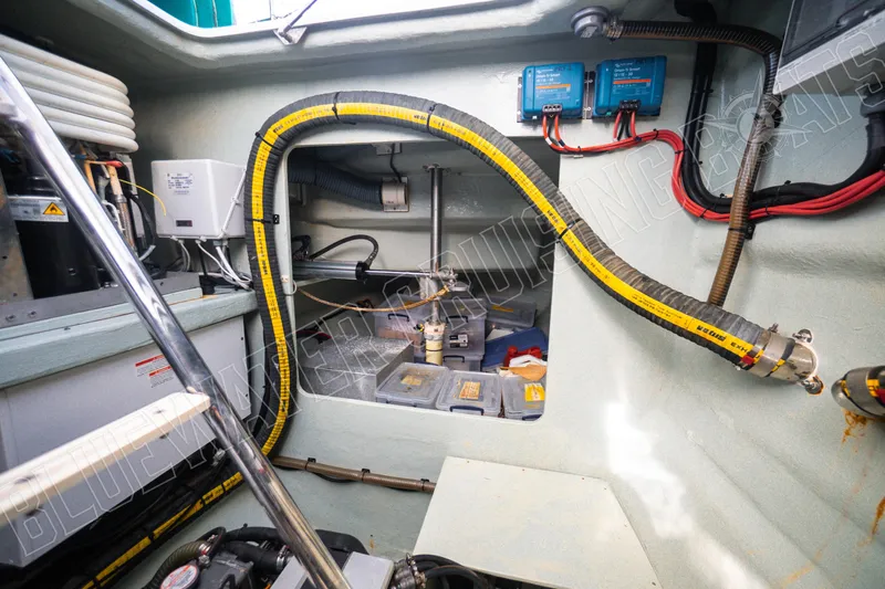 Sea Dog Yacht Photos Pics Engine room of a 2020 Leopard 58 yacht, featuring wiring and equipment.
