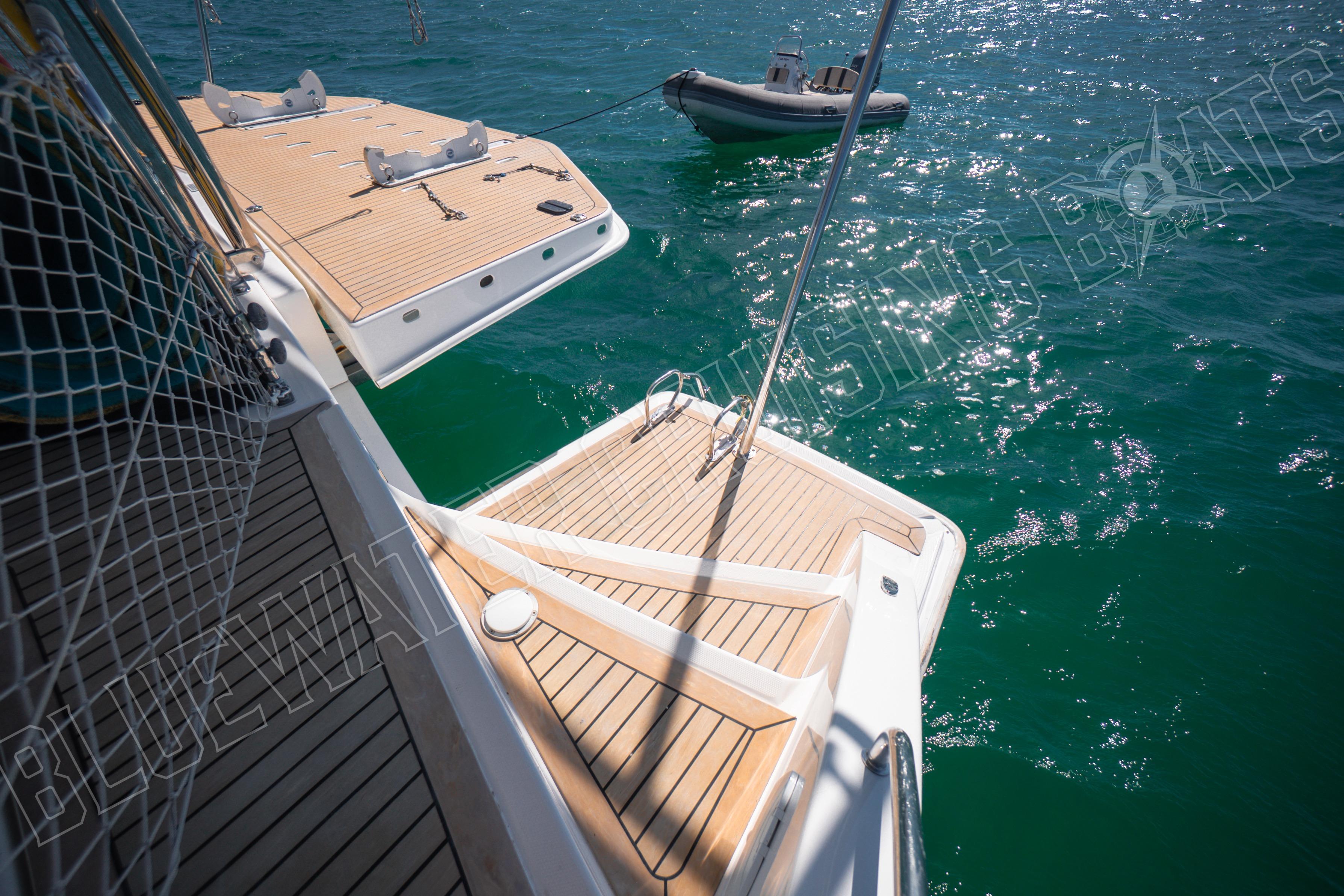 Leopard 58 yacht deck with tender boat on turquoise water, 2020 model.
