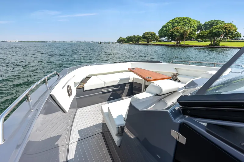  Yacht Photos Pics 2023 Cruisers Yachts 42 GLS OB, luxurious deck view on serene waters.