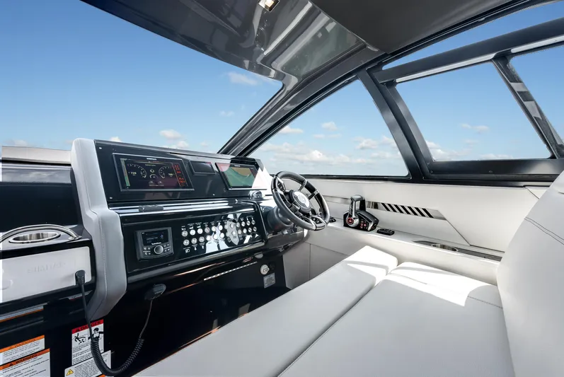  Yacht Photos Pics 2023 Cruisers Yachts 42 GLS OB helm with modern controls and panoramic view.