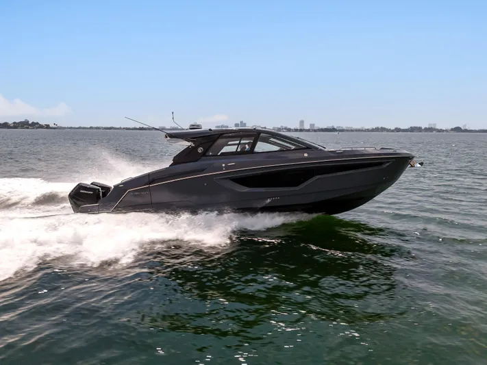  Yacht Photos Pics 2023 Cruisers Yachts 42 GLS OB speeding on open water, showcasing sleek design and performance.
