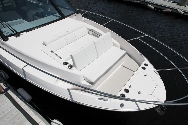  Yacht Photos Pics Manufacturer Provided Image: 2026 Regal 36 Grande Coupe boat with sleek white deck and seating area.