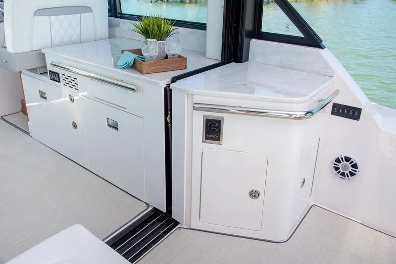  Yacht Photos Pics Manufacturer Provided Image: 2026 Regal 36 Grande Coupe interior with modern cabinetry and sleek design.