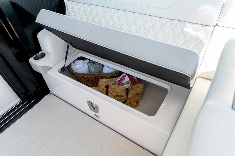  Yacht Photos Pics Manufacturer Provided Image: Storage compartment in 2026 Regal 36 Grande Coupe, featuring elegant seating and practical storage.