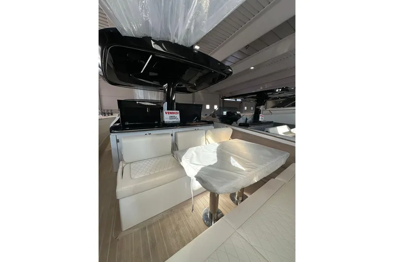  Yacht Photos Pics 2024 Solaris Power 44 Open yacht interior with elegant seating and dining area.