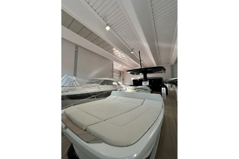  Yacht Photos Pics 2024 Solaris Power 44 Open yacht in showroom, featuring sleek design and luxurious seating.