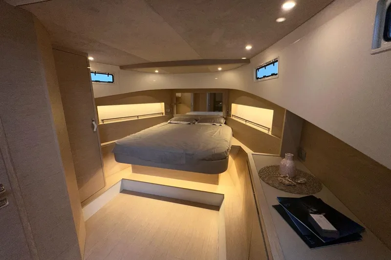  Yacht Photos Pics Luxurious interior cabin of 2025 Solaris Power 44 Open yacht, featuring modern design and ambient lighting.