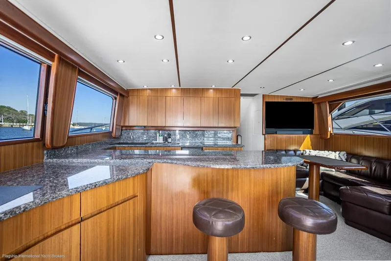 Viking 60 Yacht Photos Pics Luxurious interior of 2008 Viking 60 Convertible yacht with modern kitchen and seating area.