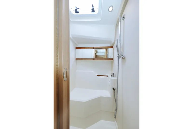 Apollo Yacht Photos Pics 2019 Hanse 458 yacht bathroom with modern fixtures and skylight.