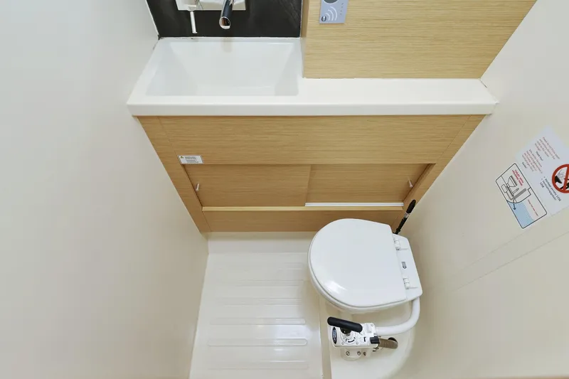 Apollo Yacht Photos Pics Compact bathroom in 2019 Hanse 458 yacht with sink and marine toilet.