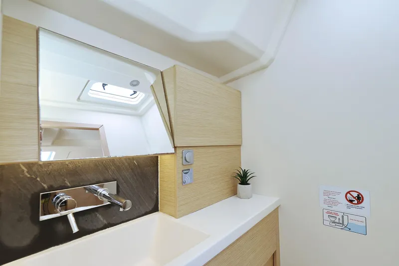 Apollo Yacht Photos Pics Modern bathroom interior of 2019 Hanse 458 yacht with sleek sink and mirror.