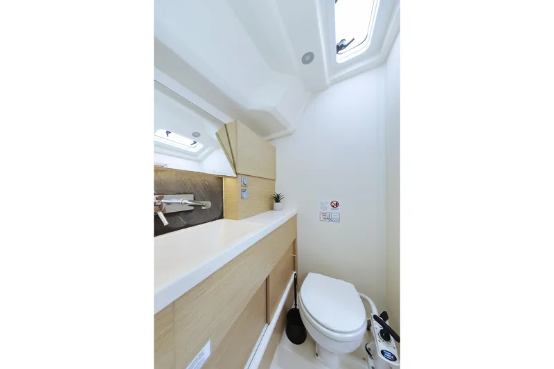 Apollo Yacht Photos Pics Modern bathroom interior in 2019 Hanse 458 yacht, featuring sleek design and natural light.