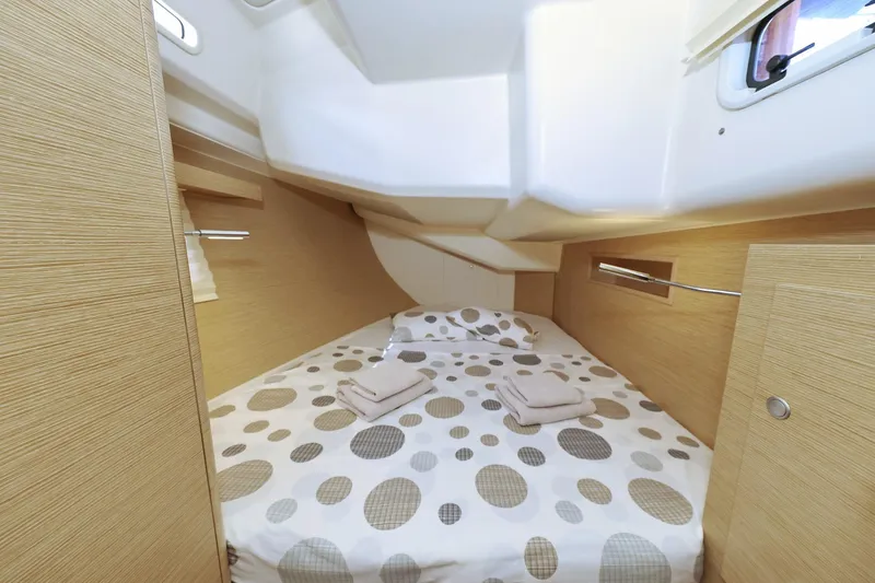 Apollo Yacht Photos Pics Cozy cabin interior of 2019 Hanse 458 yacht with polka dot bedding.