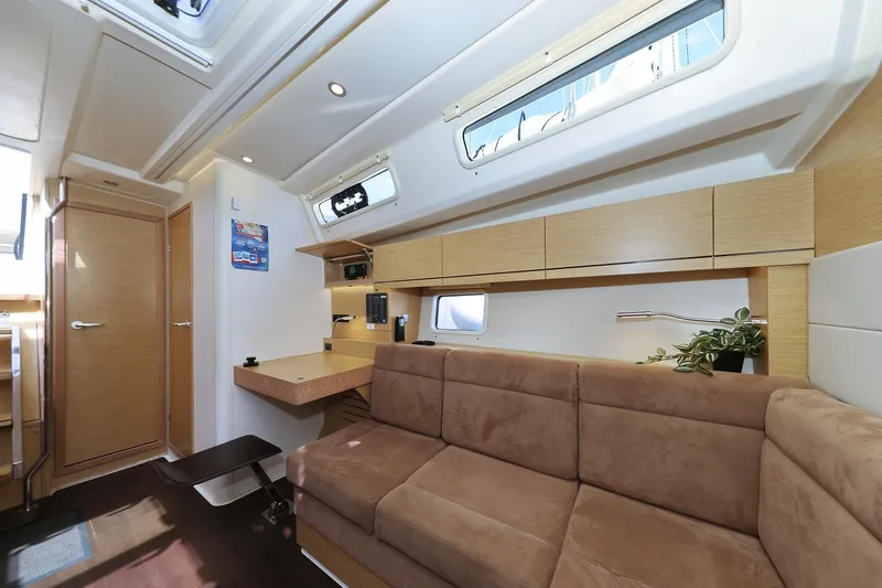 Apollo Yacht Photos Pics Luxurious interior of 2019 Hanse 458 yacht with modern furnishings and natural light.