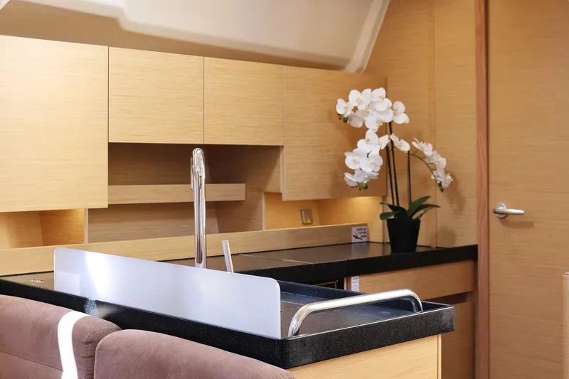 Apollo Yacht Photos Pics Modern kitchen interior on 2019 Hanse 458 yacht with sleek cabinetry and elegant orchid.