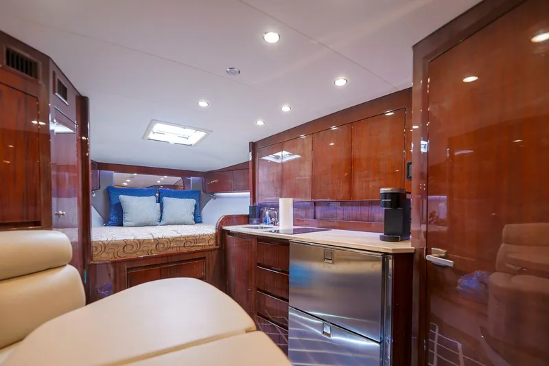 Tranquila Yacht Photos Pics Luxurious interior of 2016 Jupiter 41 EX yacht with wood finish and modern amenities.