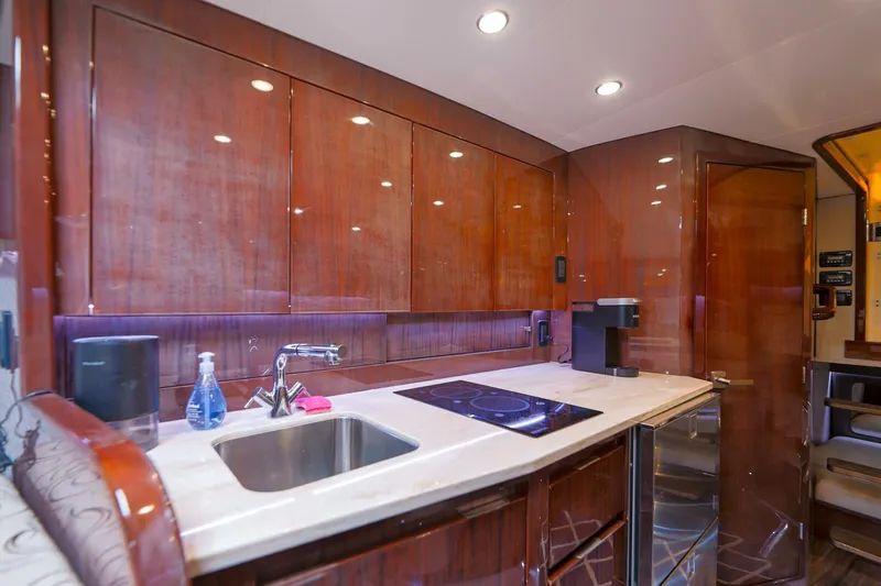 Tranquila Yacht Photos Pics Luxurious kitchen interior of 2016 Jupiter 41 EX yacht with modern amenities.