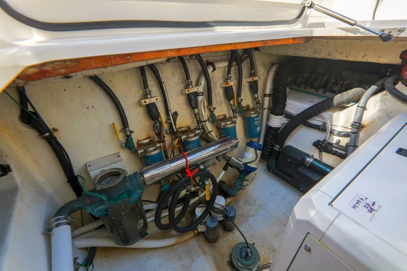 Tranquila Yacht Photos Pics Engine compartment of 2016 Jupiter 41 EX boat with visible wiring and components.