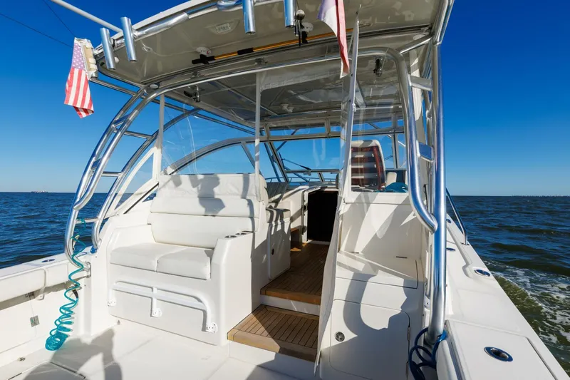 Tranquila Yacht Photos Pics 2016 Jupiter 41 EX boat interior with seating, ocean view, and clear blue sky.