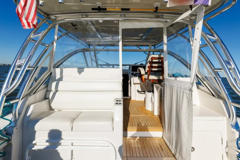 Tranquila Yacht Photos Pics 2016 Jupiter 41 EX yacht interior with seating and helm, featuring sleek design and ocean view.