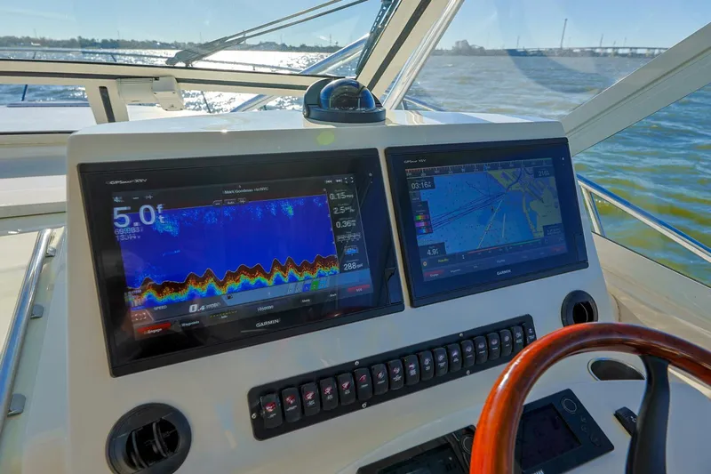 Tranquila Yacht Photos Pics 2016 Jupiter 41 EX helm with dual navigation screens and control panel.