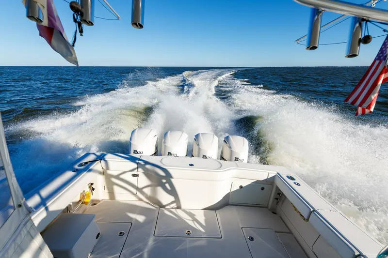 Tranquila Yacht Photos Pics 2016 Jupiter 41 EX boat cruising on open water, leaving a wake.