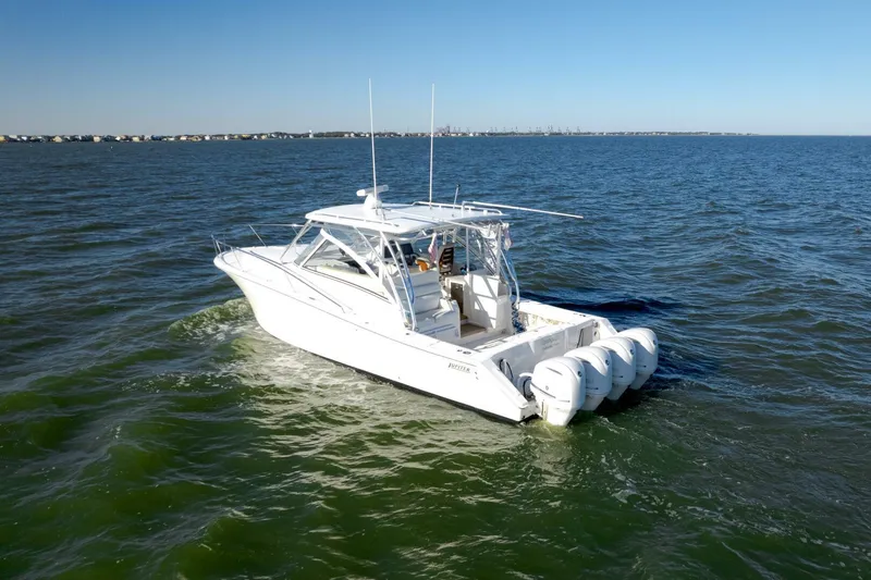 Tranquila Yacht Photos Pics 2016 Jupiter 41 EX boat cruising on open water with four engines.