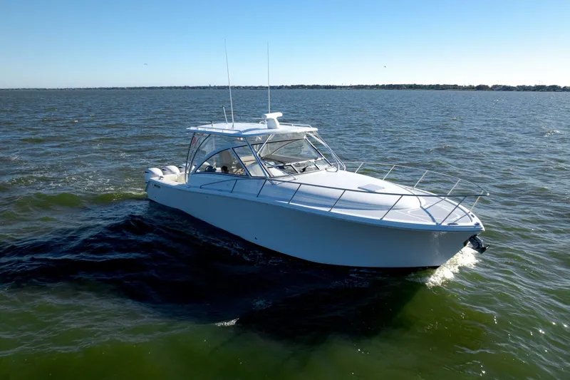 Tranquila Yacht Photos Pics 2016 Jupiter 41 EX boat cruising on open water.