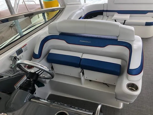  Yacht Photos Pics 2017 Formula 400 Super Sport boat interior with plush seating and steering wheel.