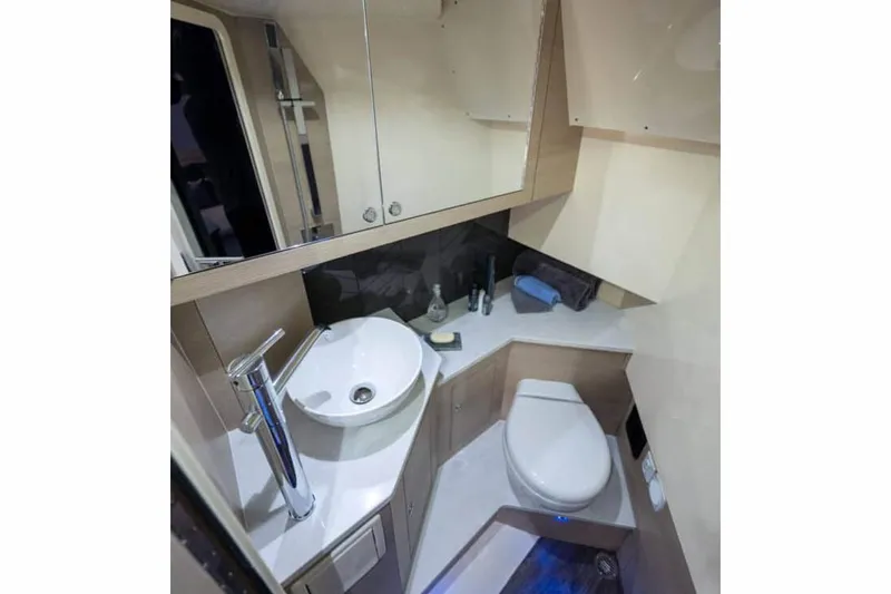  Yacht Photos Pics Manufacturer Provided Image: 2023 Scout 350 LXZ boat bathroom with modern fixtures and compact design.