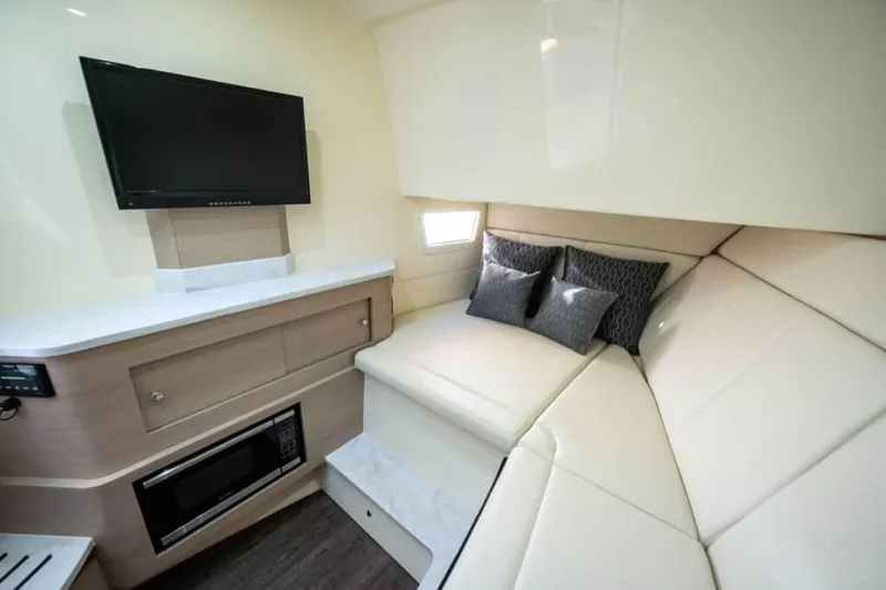  Yacht Photos Pics Manufacturer Provided Image: 2022 Scout 350 LXZ cabin interior with TV, microwave, and cozy seating.