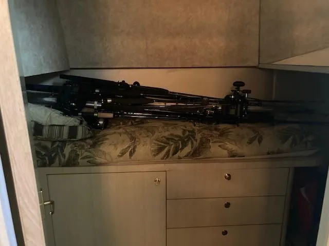 Lady G Yacht Photos Pics 1998 Ocean Yachts 45 Super Sport cabin with fishing rods on bed