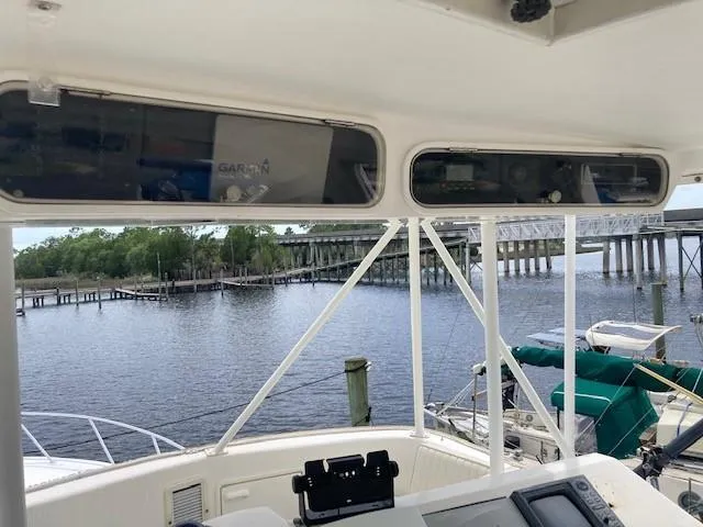 Lady G Yacht Photos Pics 1998 Ocean Yachts 45 Super Sport cockpit view with bridge and waterway in background.