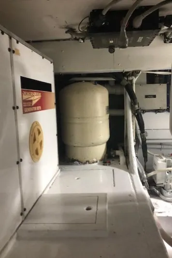  Yacht Photos Pics 1997 Bertram Convertible engine room with equipment and machinery.