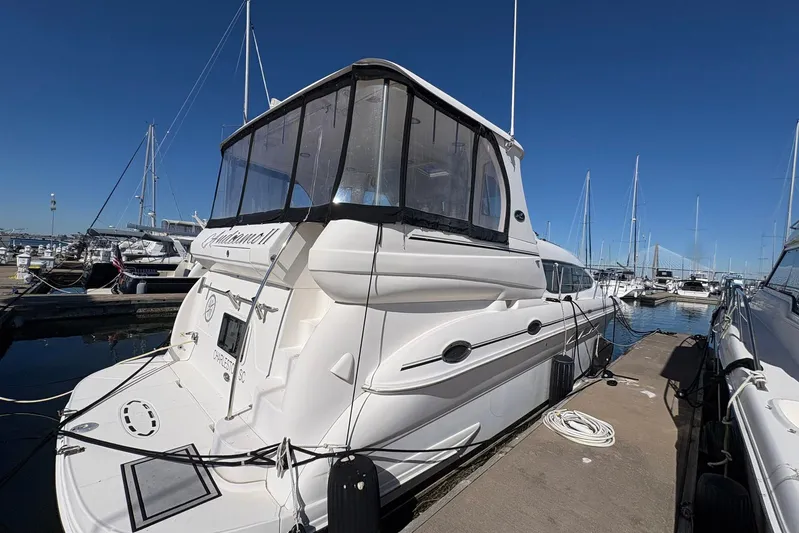 Andiamo II Yacht Photos Pics 2002 Sea Ray 480 Motor Yacht docked at marina under clear blue sky.