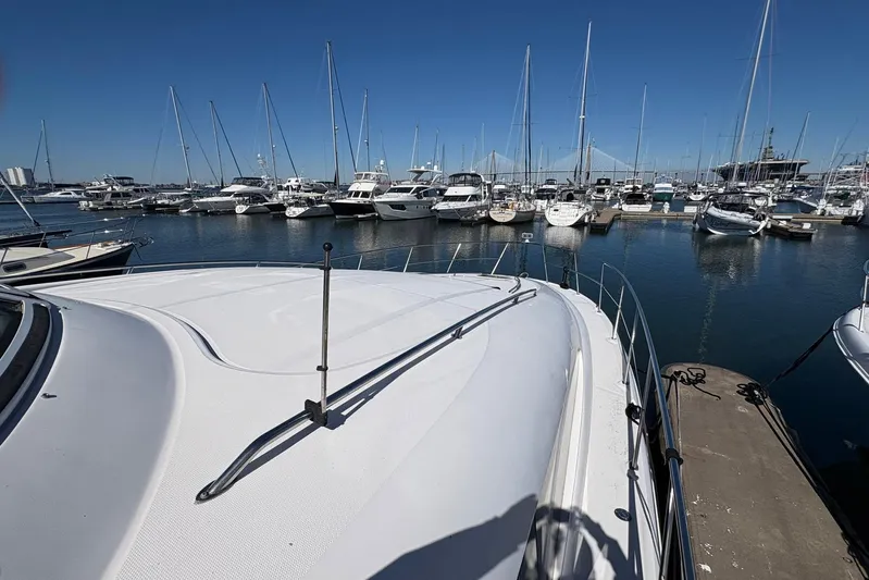 Andiamo II Yacht Photos Pics 2002 Sea Ray 480 Motor Yacht docked in a marina with other boats.